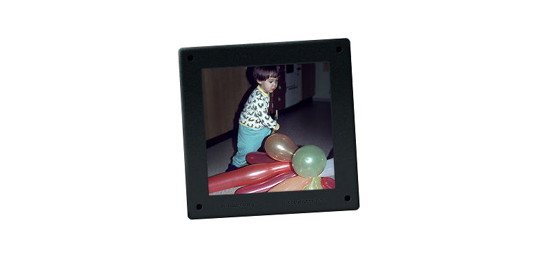 Photograph of the artist at three years old playing with colourful balloons on his third birthday, 16 December 1976