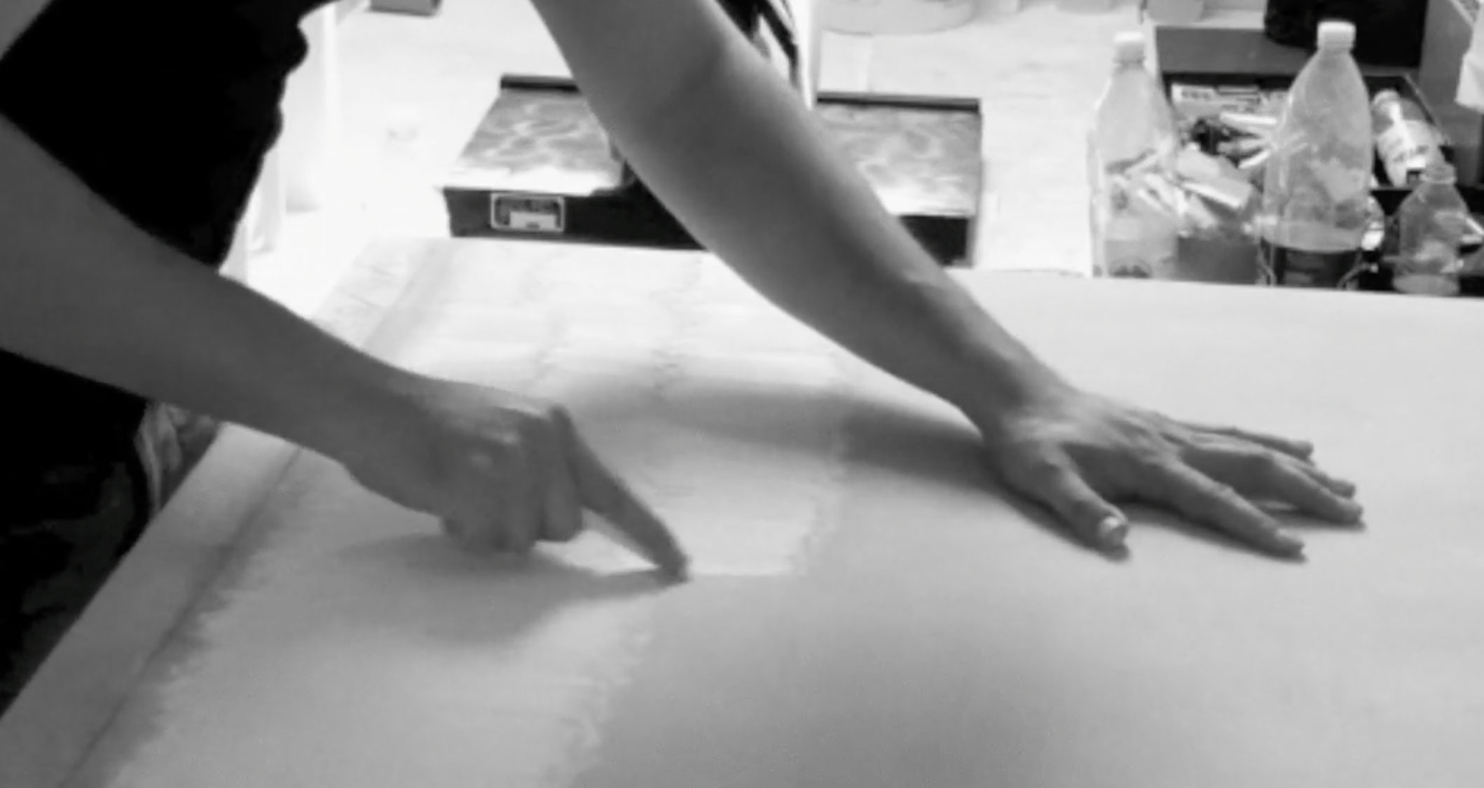 Video still showing the surface being levelled with a chalk stick
