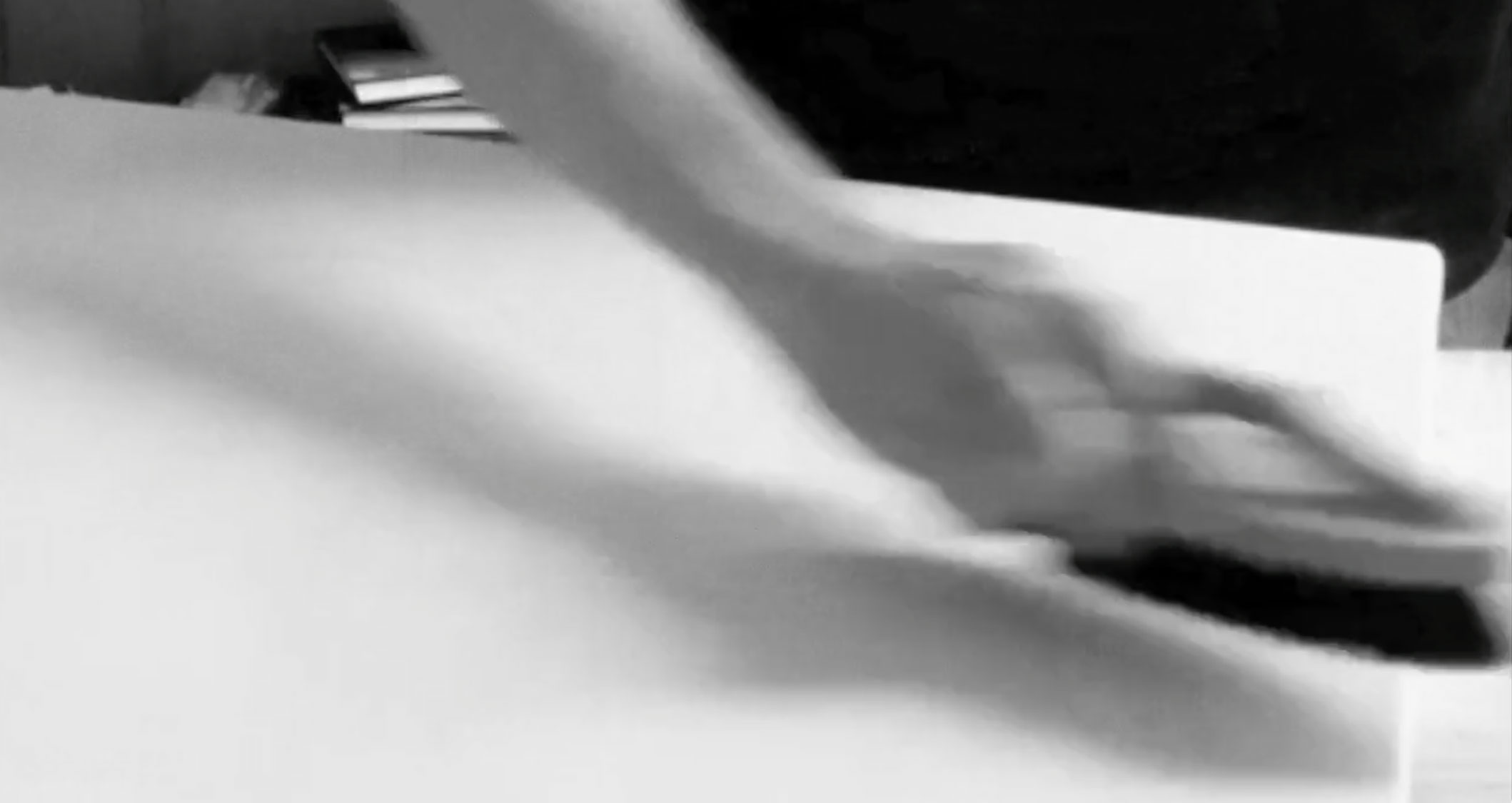 Video still showing the surface being dusted with a soft brush