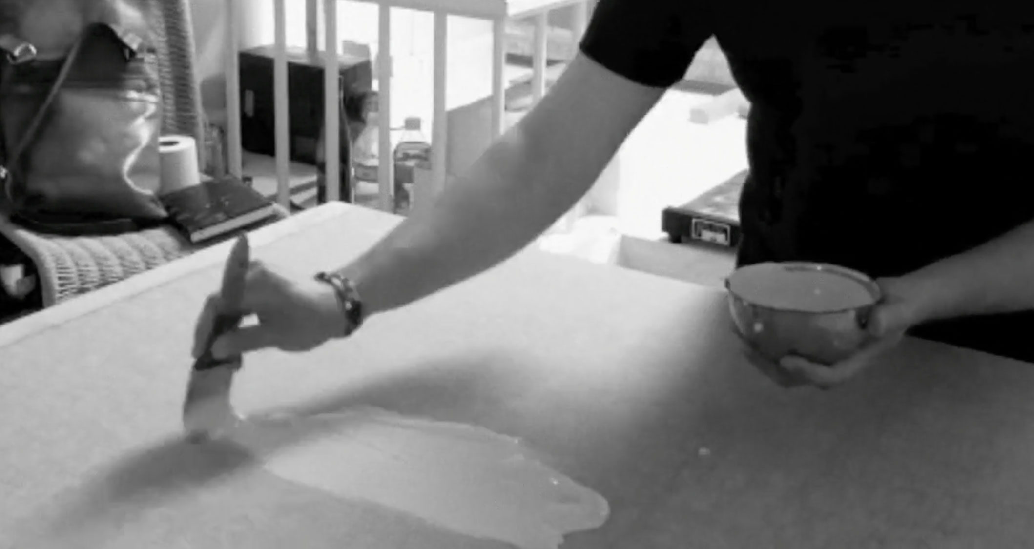 Video still showing the initial mineral layer being applied to the surface