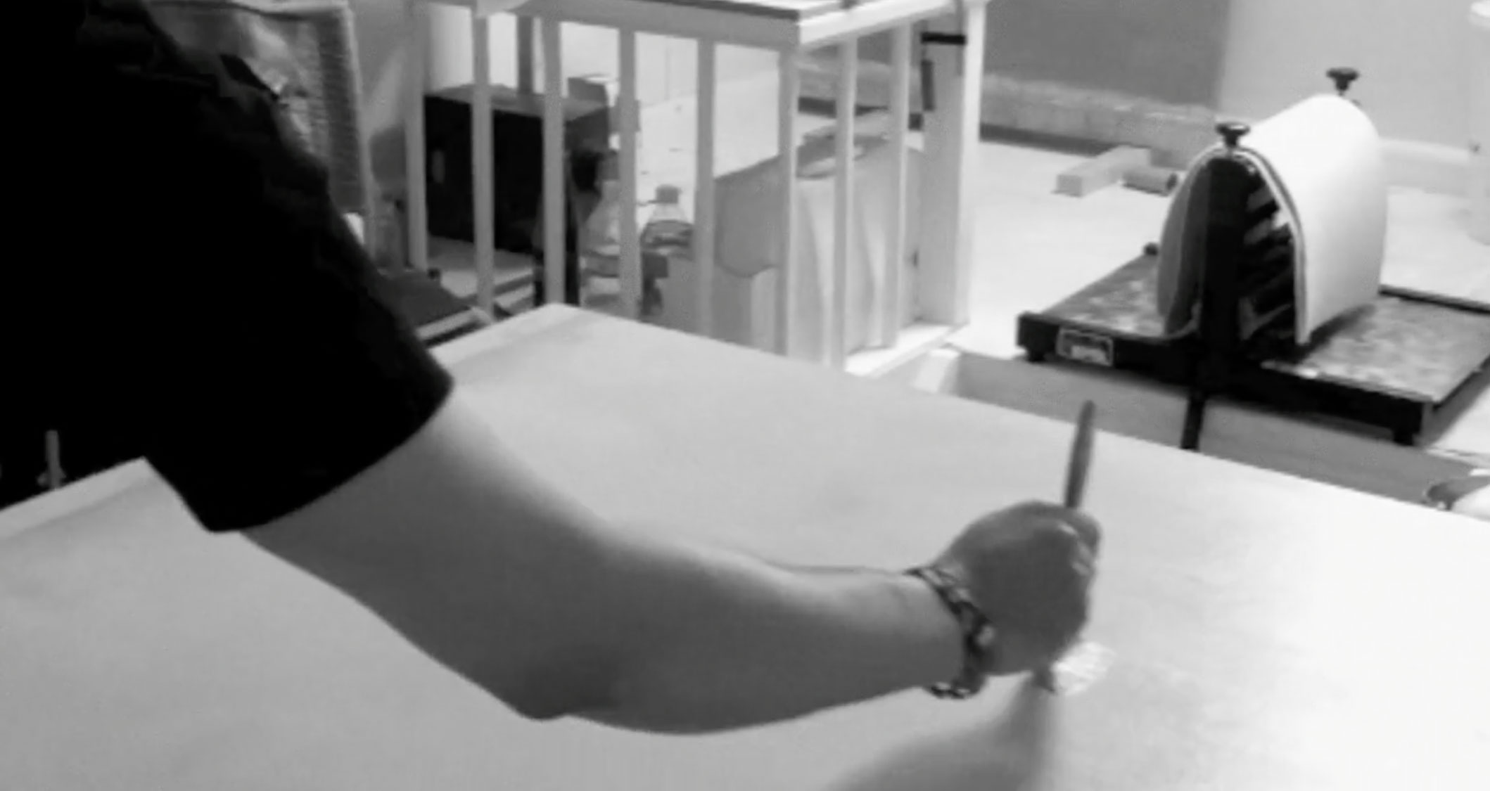 Video still showing the final stage of applying the initial mineral layer to the surface