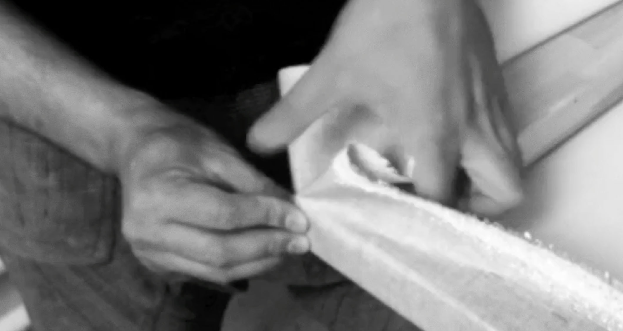 Video still showing factory-primed flax linen being mounted in reverse